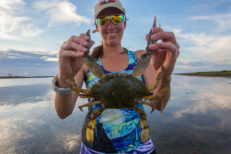 Person holding a crab