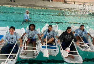 Group of camp seaport canoers in pool