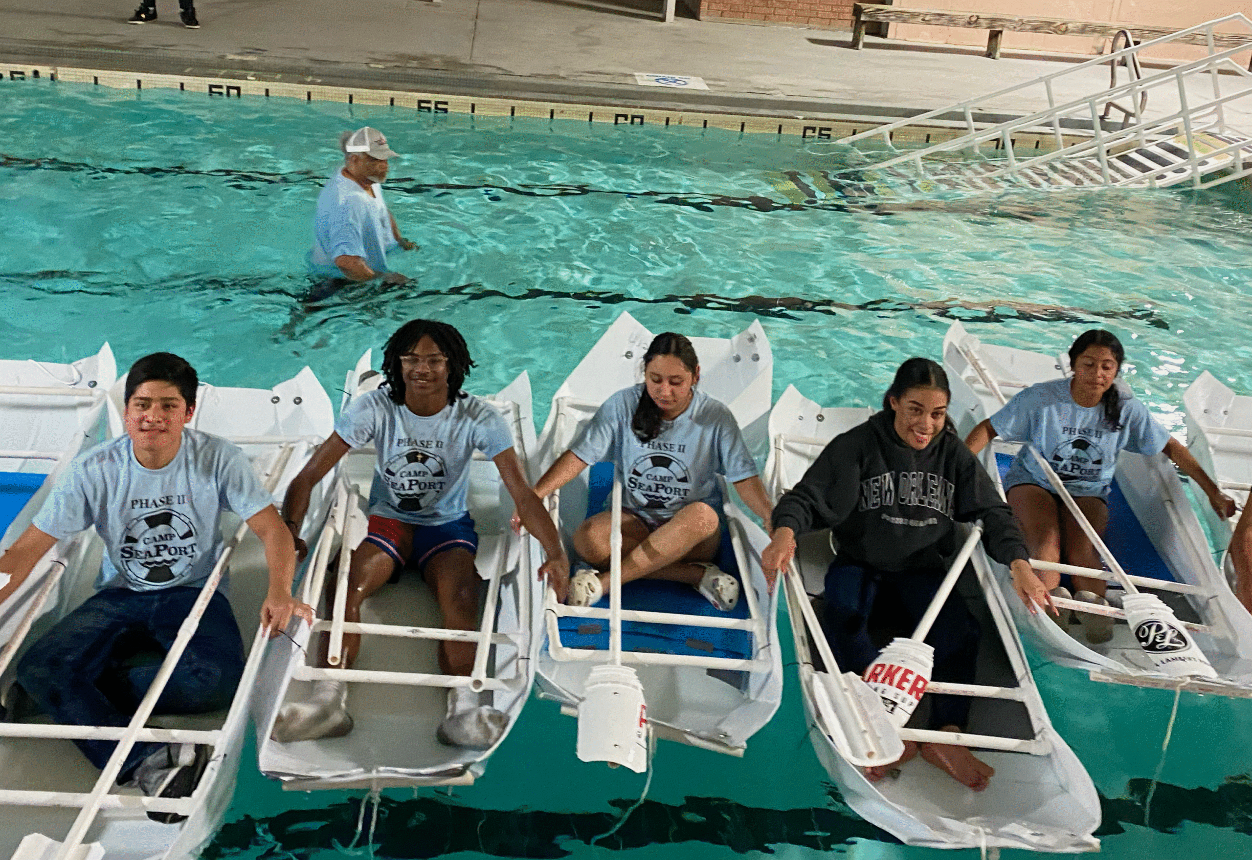 Group of camp seaport canoers in pool