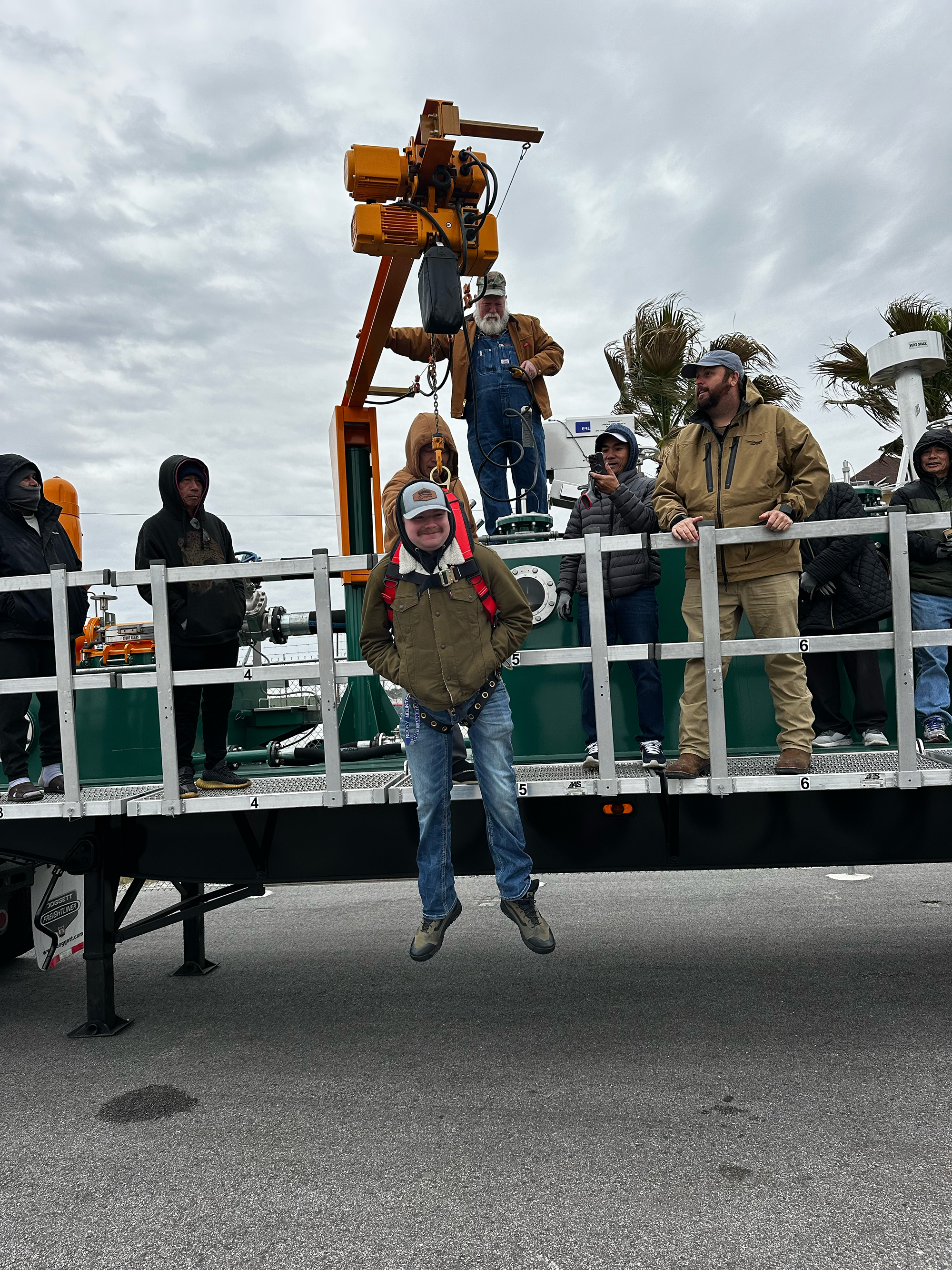 A fisherman being lifted during a rescue simulation.