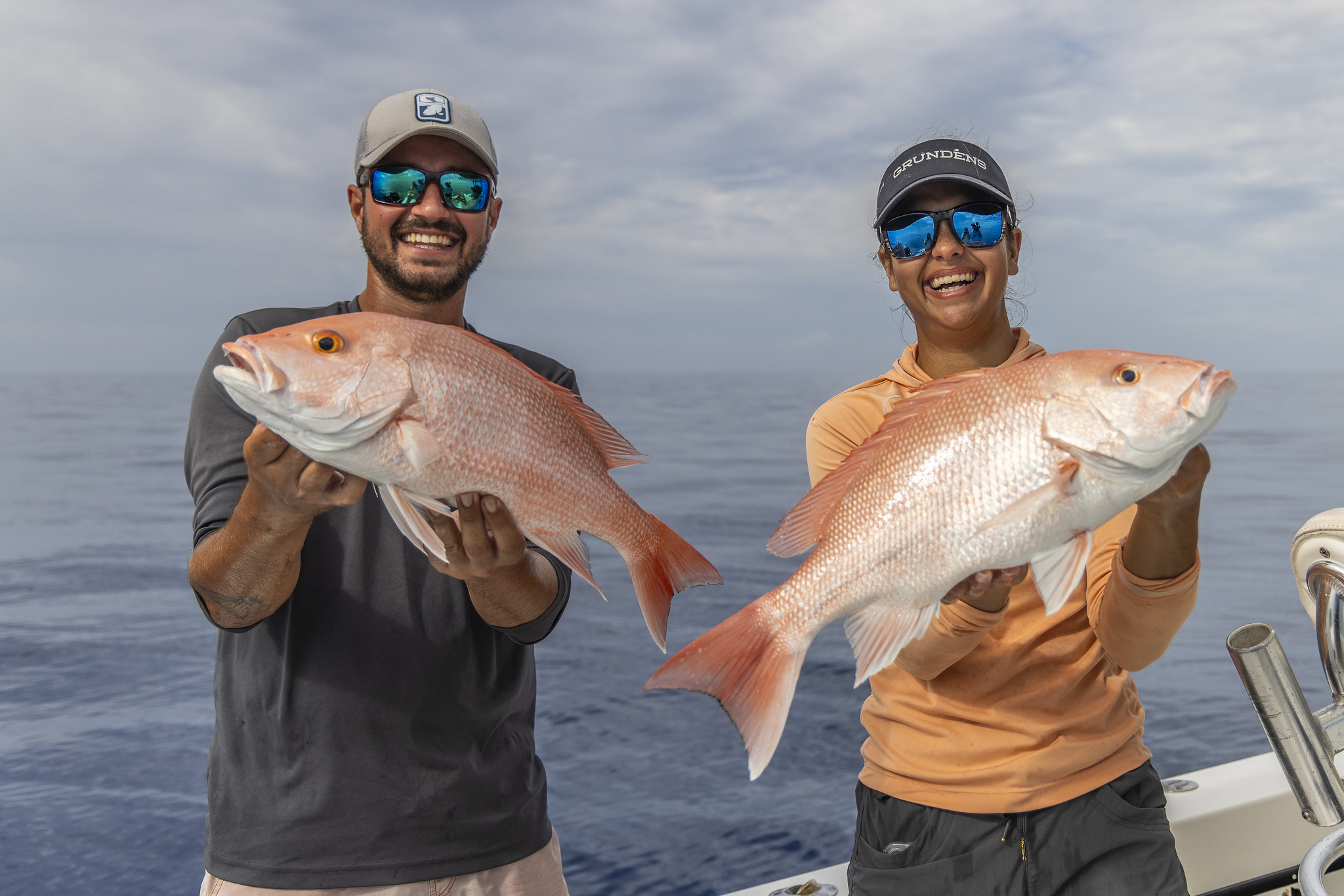 Nick Haddad And Alex Spring hold red snapper