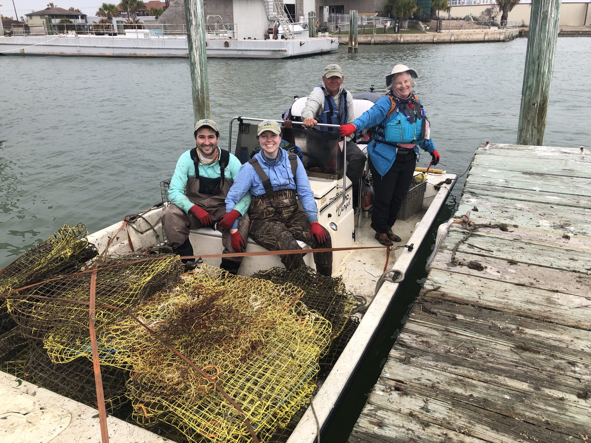 crab trap cleanup smiling group