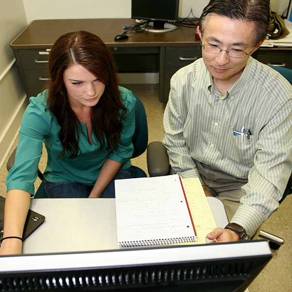 2 LAUNCH Scholars reviewing material