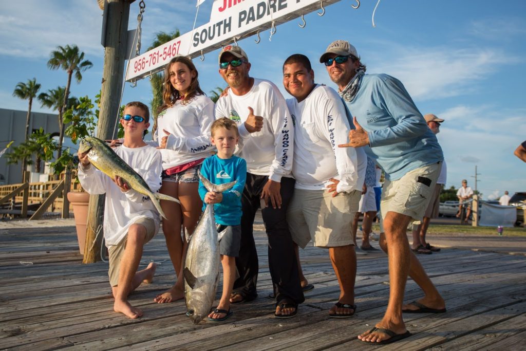 A group poses with their tournament catches.