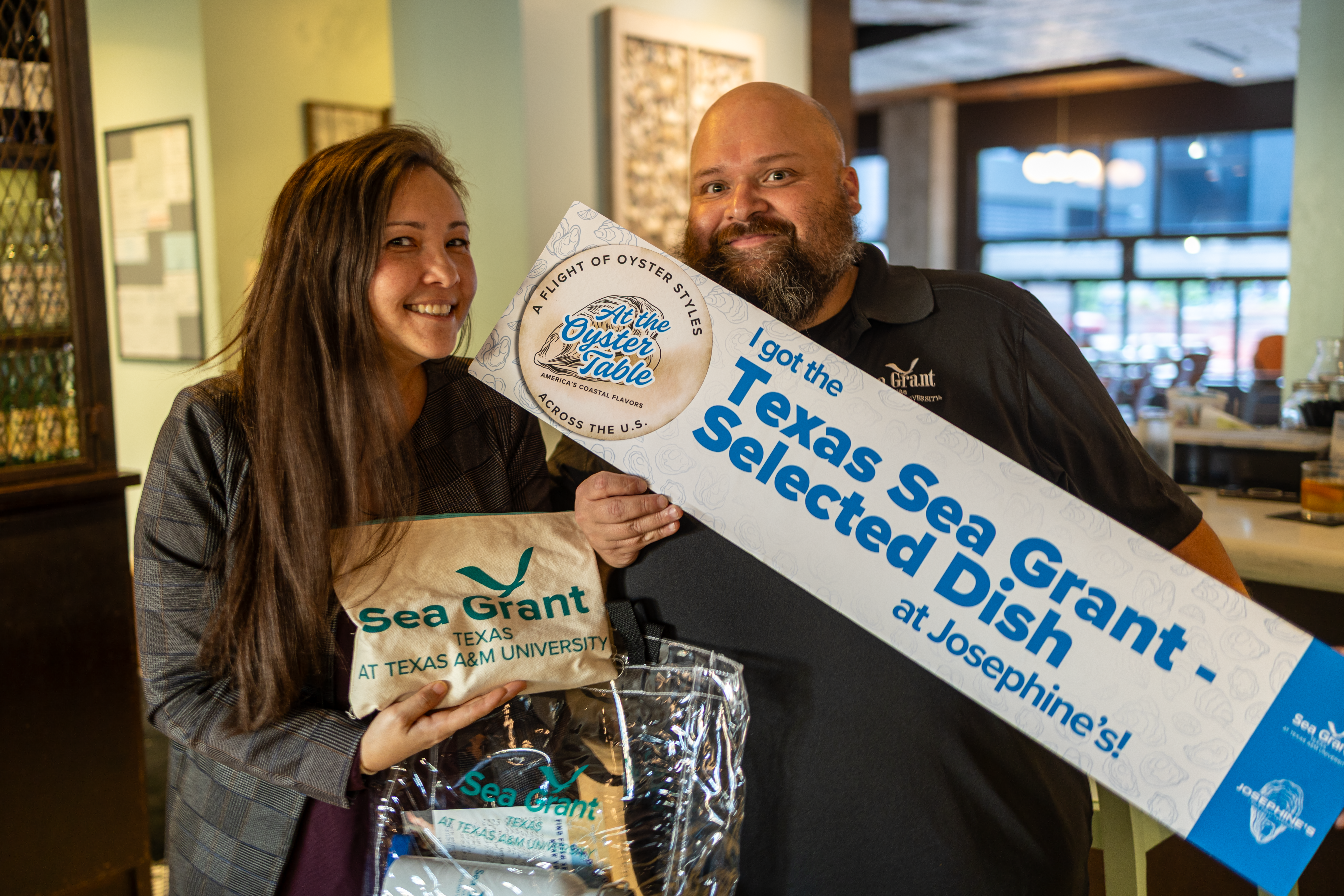 Mario Marquez with Sea Grant Swag from Texas Gulf Oyster Night