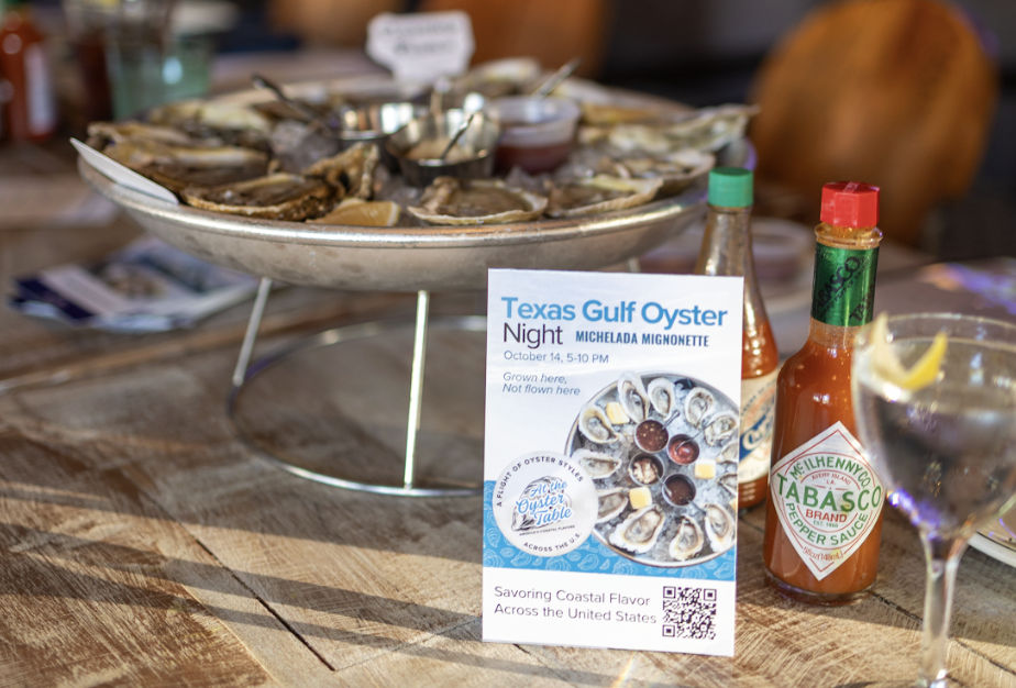 A dish of local oysters with hot sauce presented with the Texas Gulf Oyster Night Card