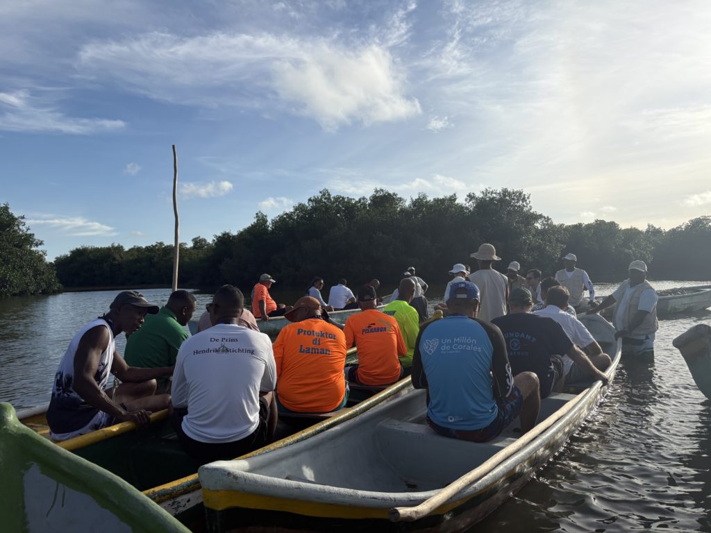 Participants in the GCFI Conference aboard multiple boats for the Fisher's Fieldtrip