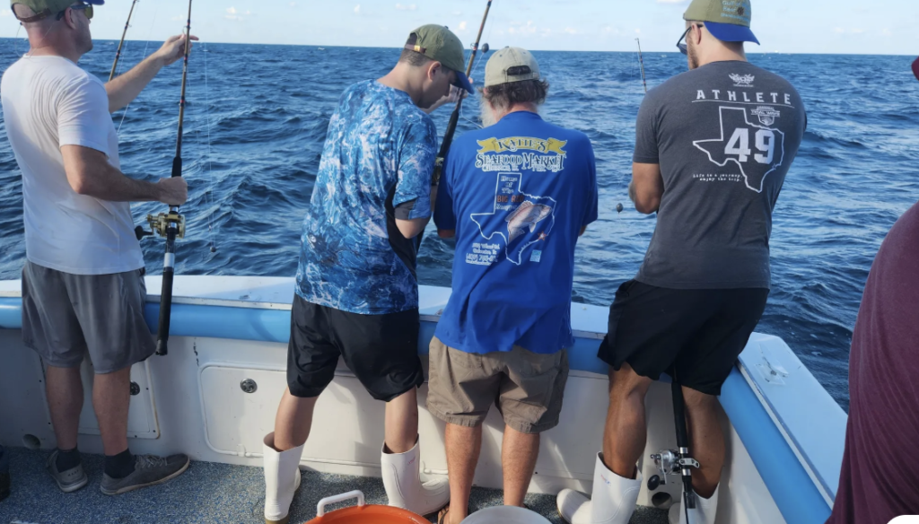 Buddy on-deck guiding trainees on deep-sea fishing at a past GCFP 