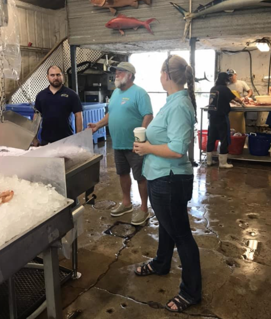 Buddy with son, Nick Gutierrez (Manager of Katie’s Seafood Market) and Laura Picariello (Director, Texas Sea Grant), educating local teachers about the commercial fishing at Katie’s Seafood Market.